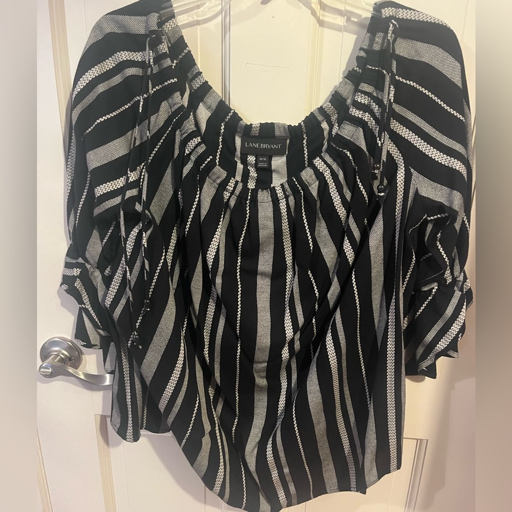 Black, gray and white striped top, 3/4 cinched sleeves.